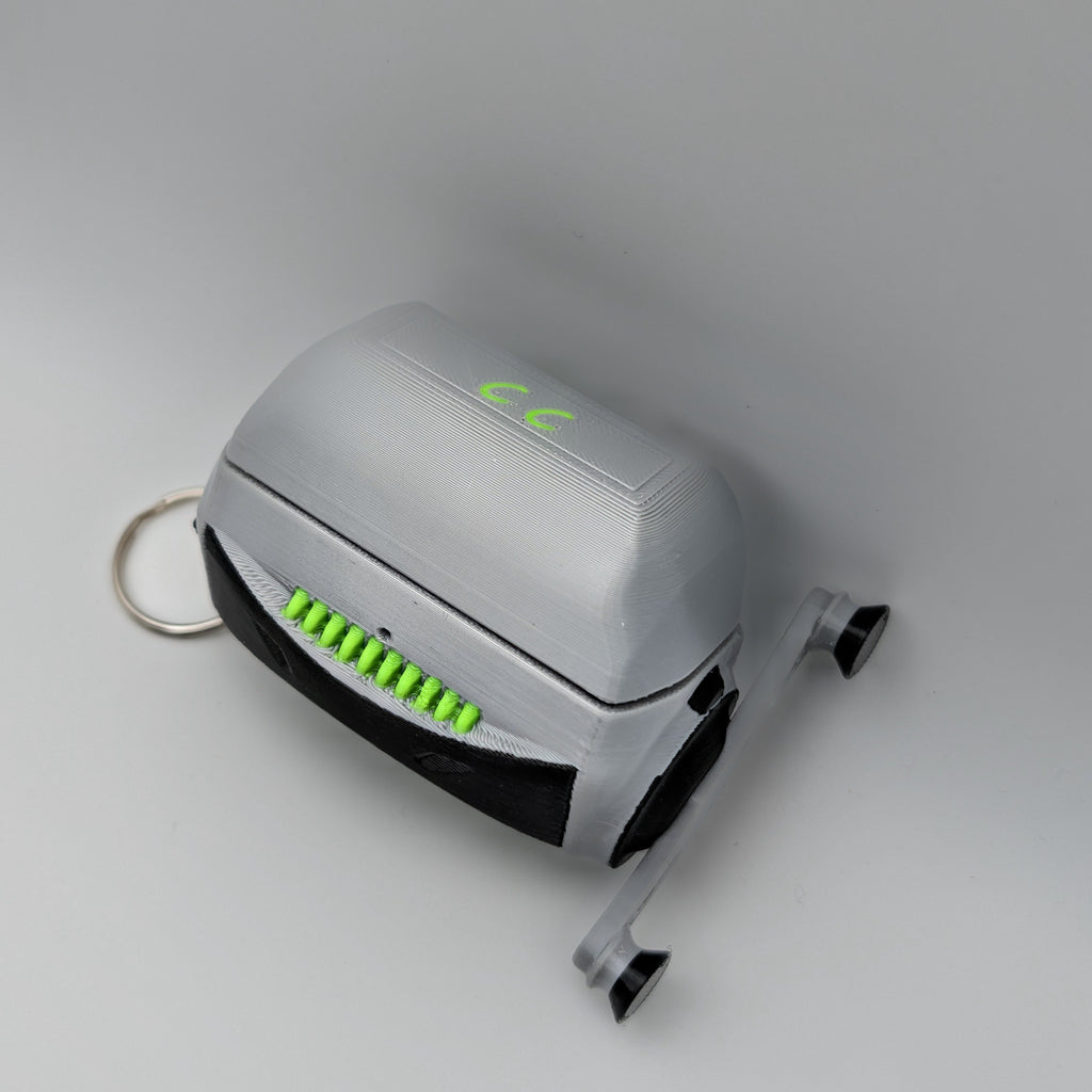 Small electronic device with green lights on a gray background